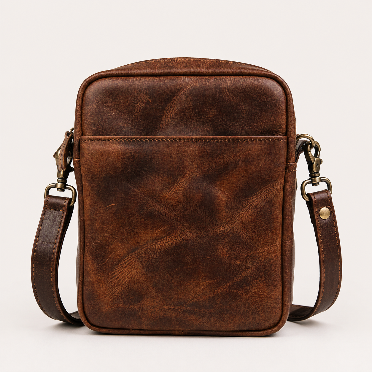Bellvari YYZ full-grain leather travel satchel with adjustable strap, available in crazy horse brown and black.