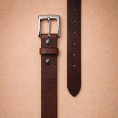 Bellvari Trailblazer leather belt rolled, showing pull-up finish with marbled creases. — view 2