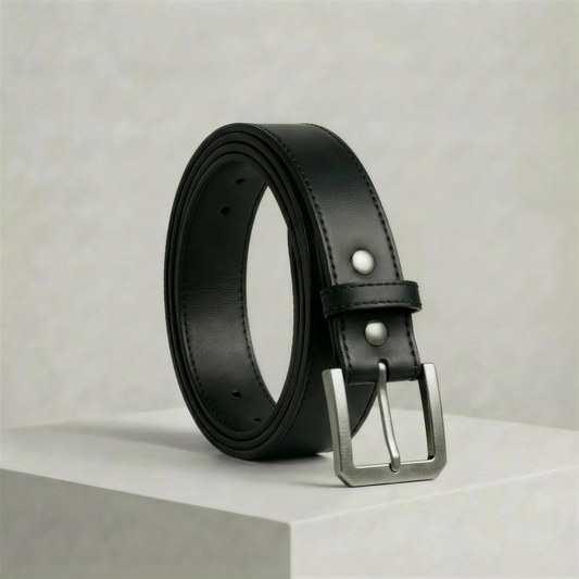 The Draftsman black full-grain leather dress belt with squared brushed-gunmetal buckle and edge stitching.