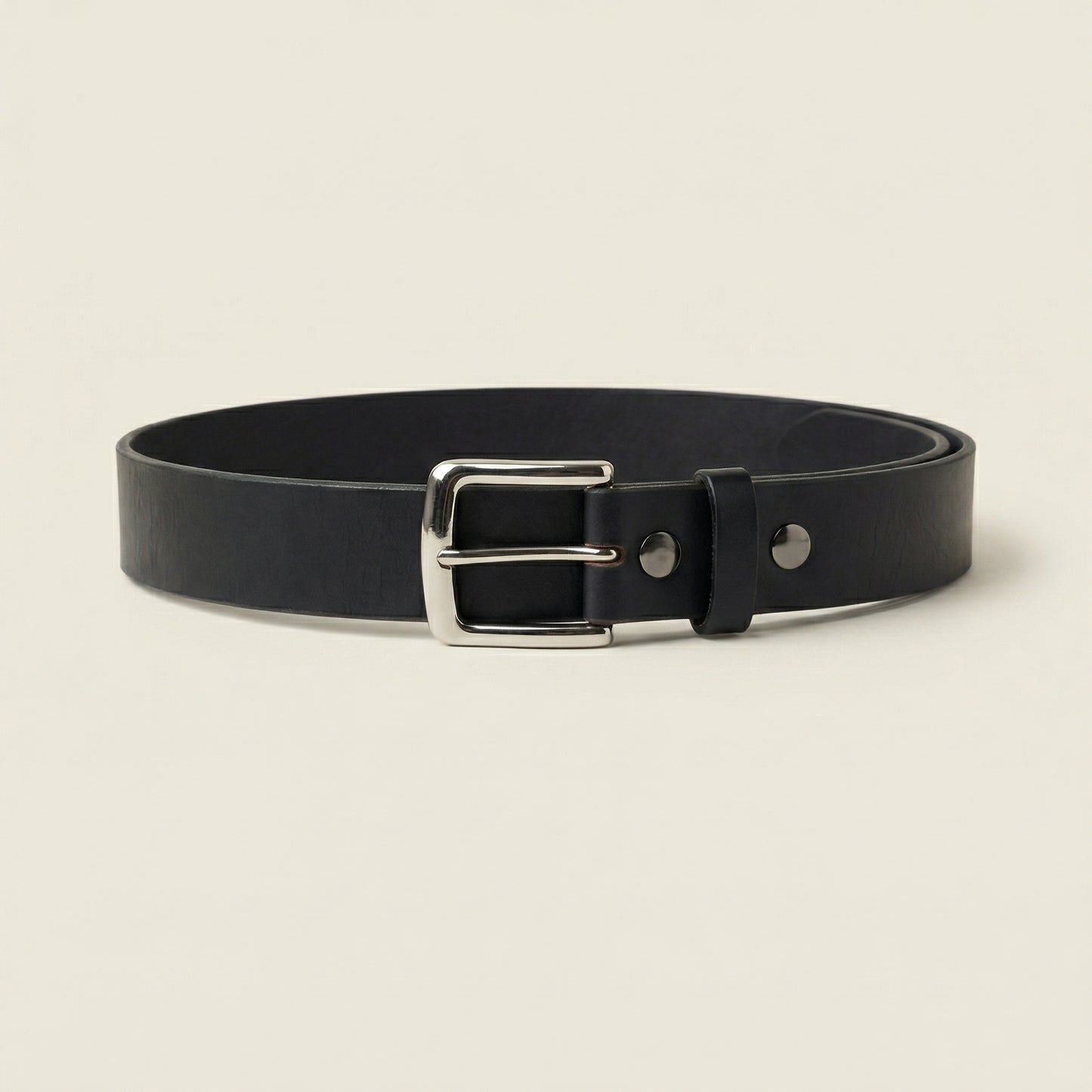 Bellvari Maverick black leather belt rolled, showing thickness.