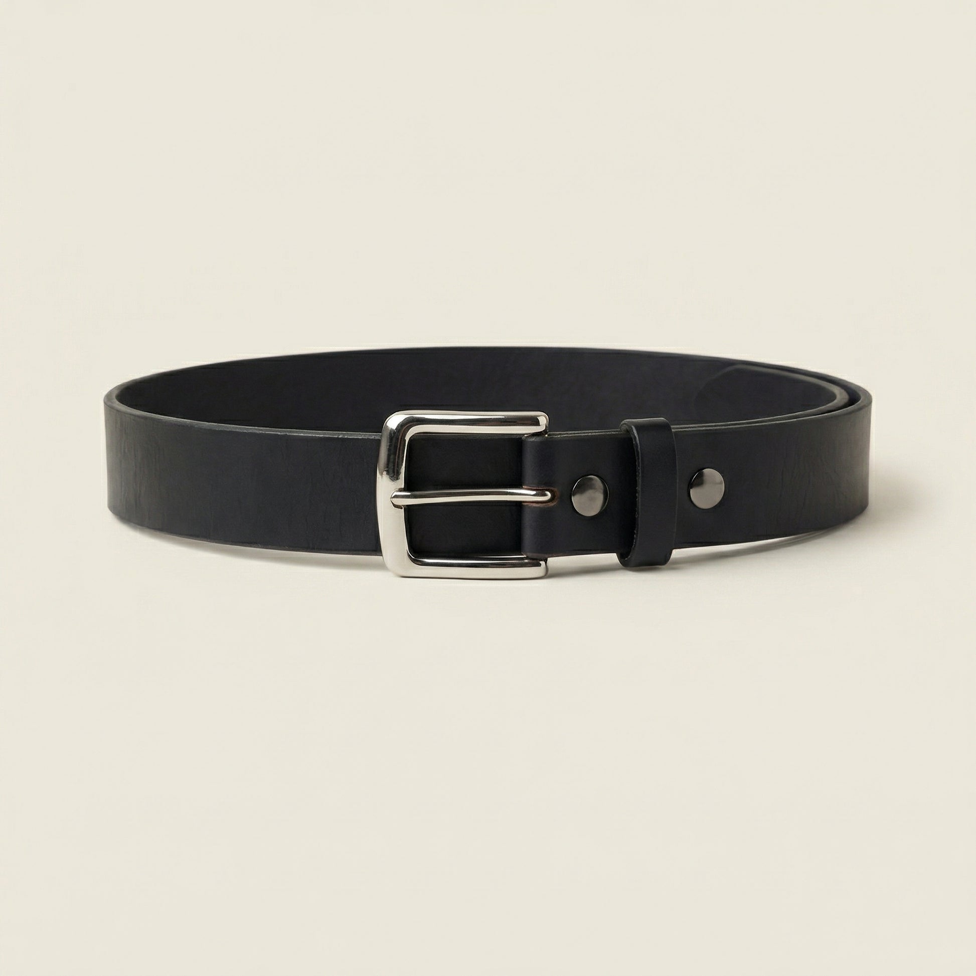 Bellvari Maverick black leather belt rolled, showing thickness.
