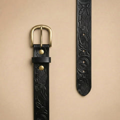Bellvari Ironhide black leather belt, detail of the hand-tooled Western pattern and antique-brass buckle. — view 6