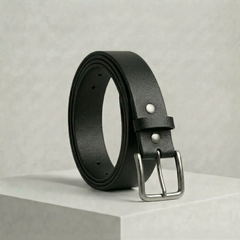 Bellvari Tradesman black full-grain leather belt coiled upright, brushed steel buckle, on a neutral studio background. — view 1